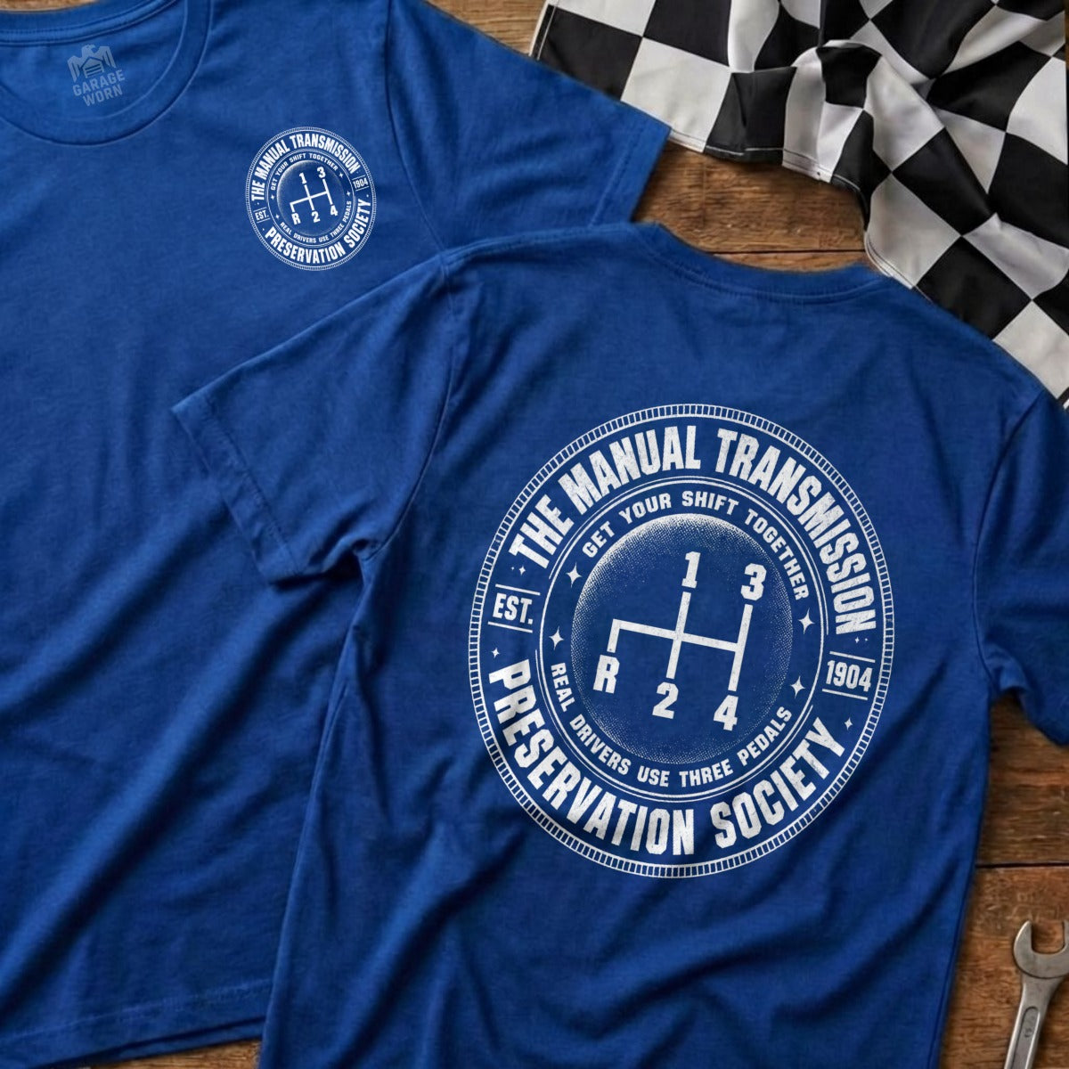 Blue t-shirt with "The Manual Transmission Preservation Society" and gear shift graphic.