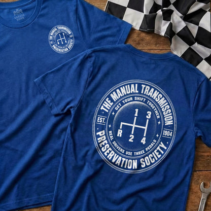 Blue t-shirt with "The Manual Transmission Preservation Society" and gear shift graphic.