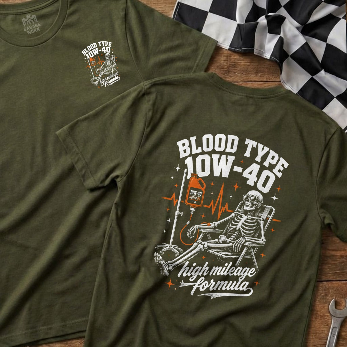 Olive green shirt with a skeleton receiving an IV drip of 10W-40 motor oil.