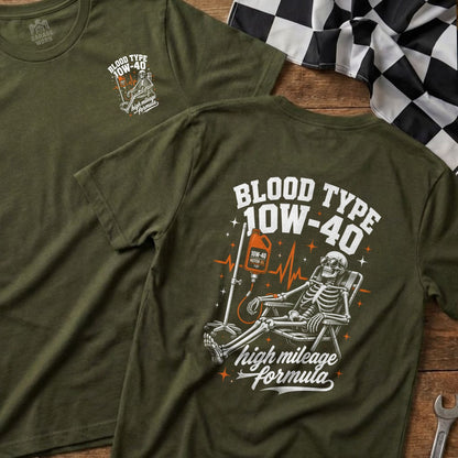Olive green shirt with a skeleton receiving an IV drip of 10W-40 motor oil.