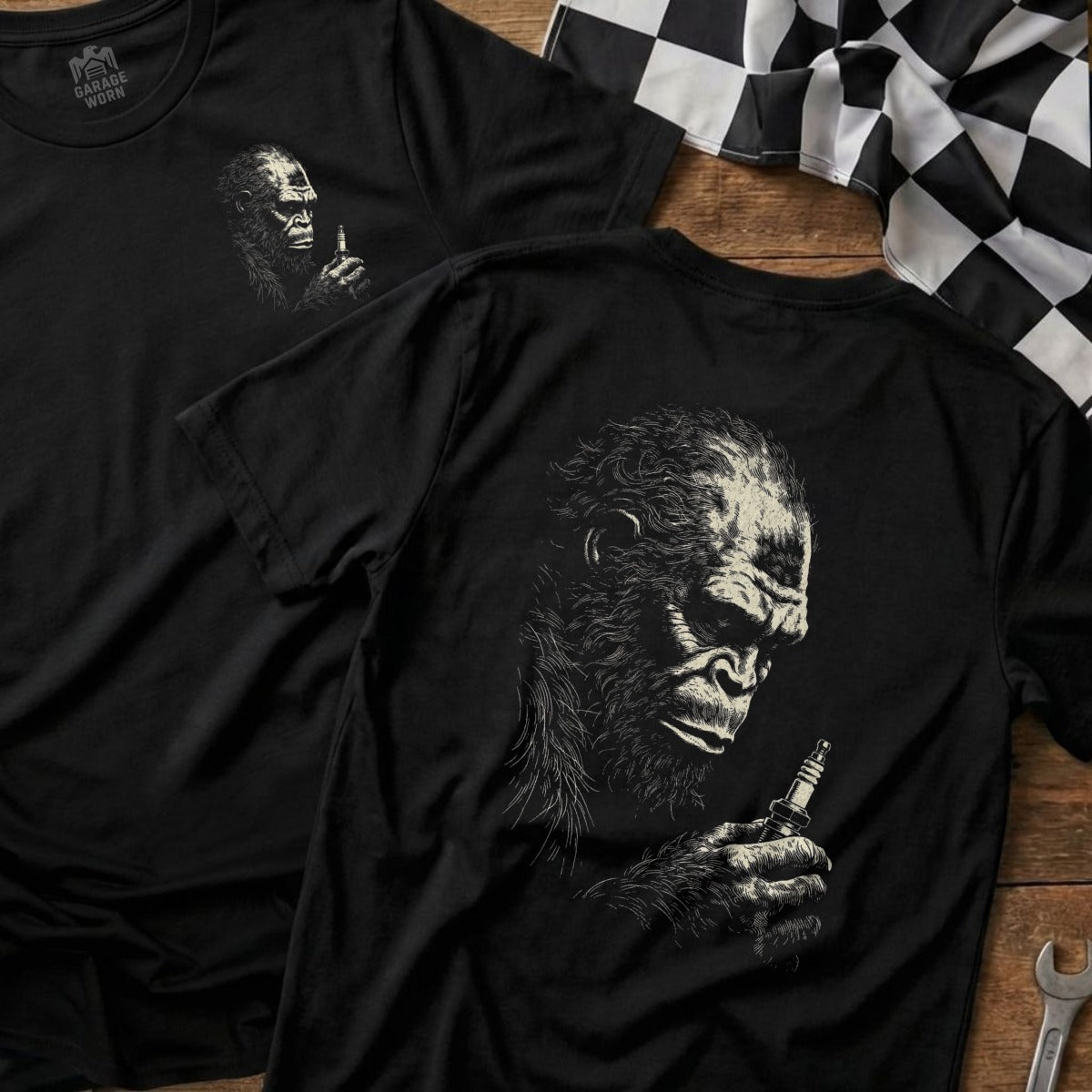 Black t-shirt with gorilla holding spark plug graphic on back.