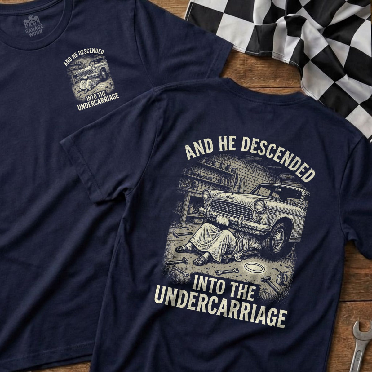 T-shirt with "AND HE DESCENDED INTO THE UNDERCARRIAGE" text and car mechanic illustration.