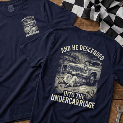 T-shirt with "AND HE DESCENDED INTO THE UNDERCARRIAGE" text and car mechanic illustration.