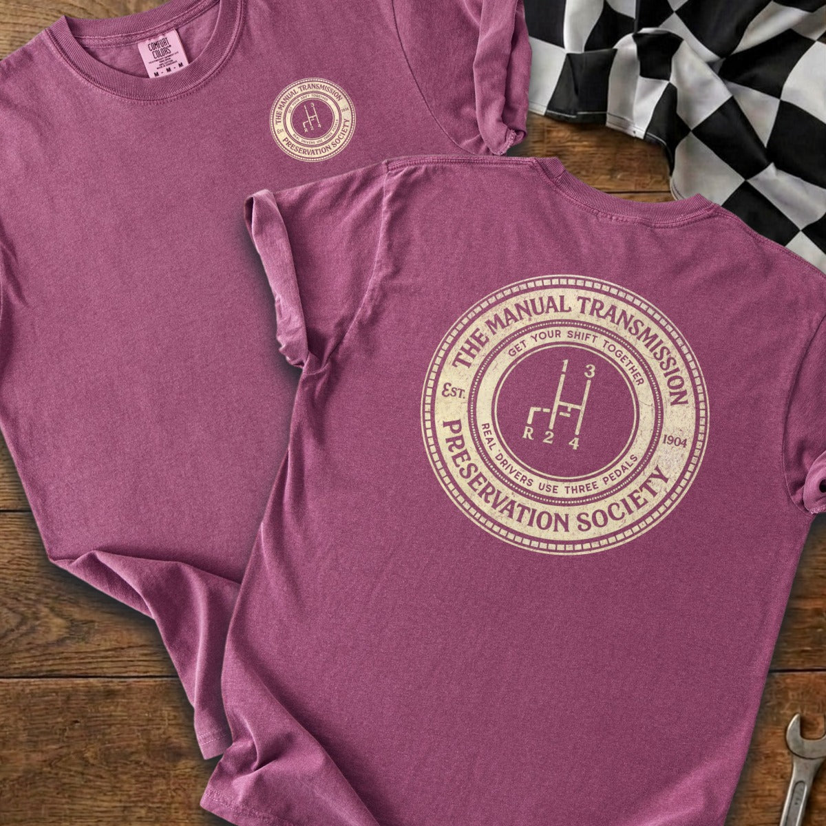 Purple t-shirt with "The Manual Transmission Preservation Society" graphic.