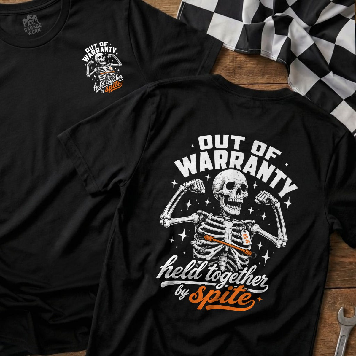 Black t-shirt with skeleton graphic, "Out of Warranty Held Together by Spite" text.