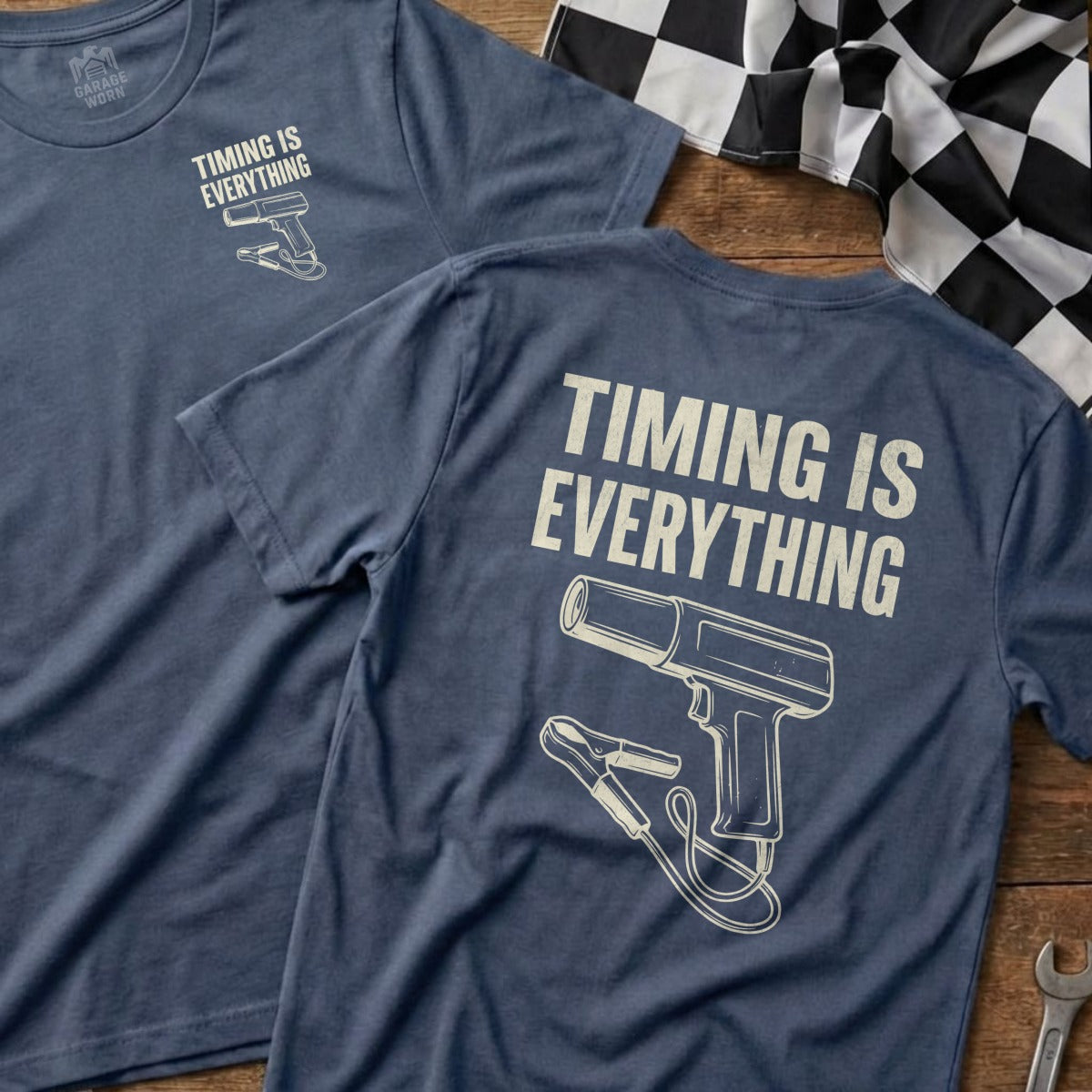 Blue t-shirt with "Timing is Everything" text and an illustration of a spark plug.