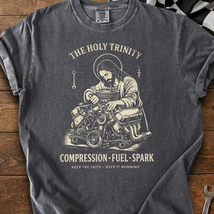 Jesus working on an engine with text "The Holy Trinity Compression Fuel Spark".