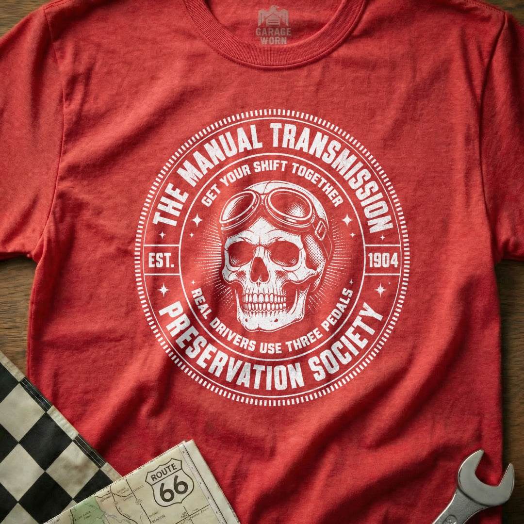 Red t-shirt with "The Manual Transmission Preservation Society" text and skull graphic.