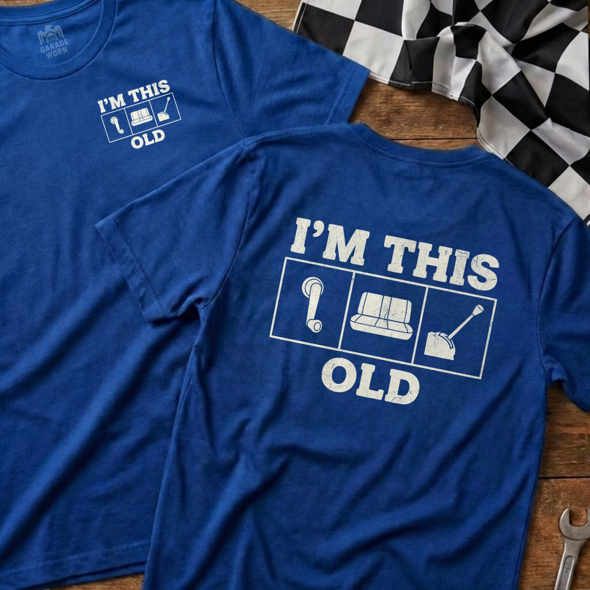 Two blue t-shirts displaying "I'm This Old" with icons and the Garage Born logo.