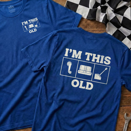 Two blue t-shirts displaying "I'm This Old" with icons and the Garage Born logo.