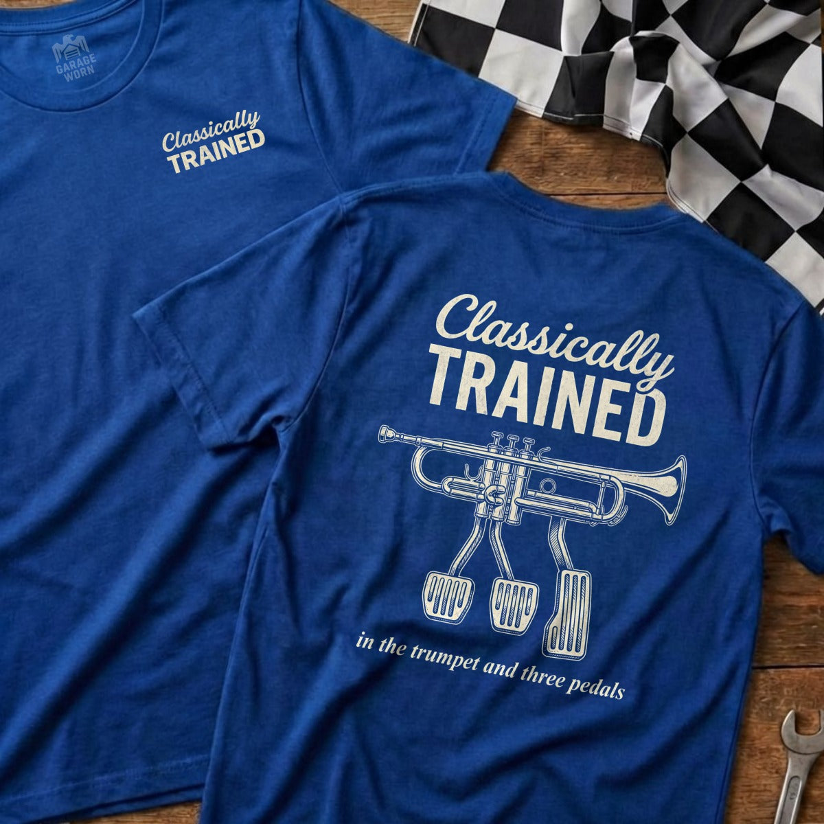 Blue t-shirt with "Classically Trained" and trumpet with pedals design.