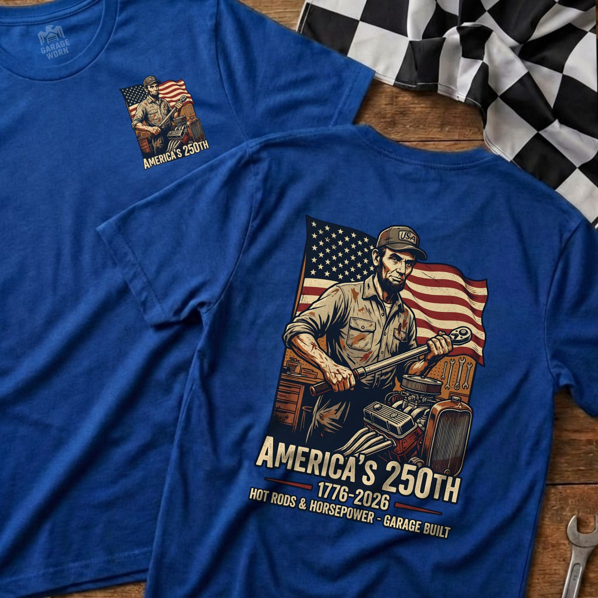 Blue t-shirt with Abraham Lincoln holding a wrench, "America's 250th" text.