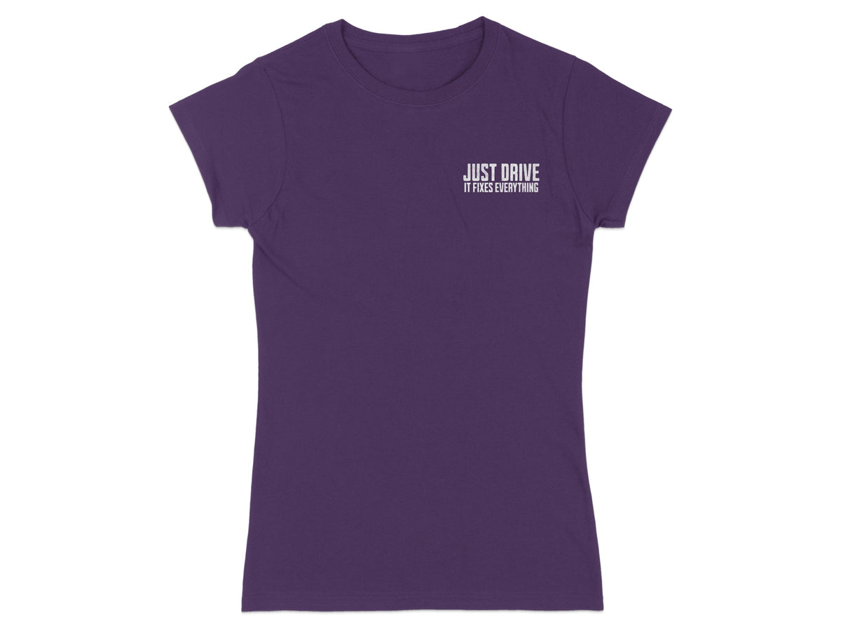 Purple t-shirt with white text "JUST DRIVE IT FIXES EVERYTHING".