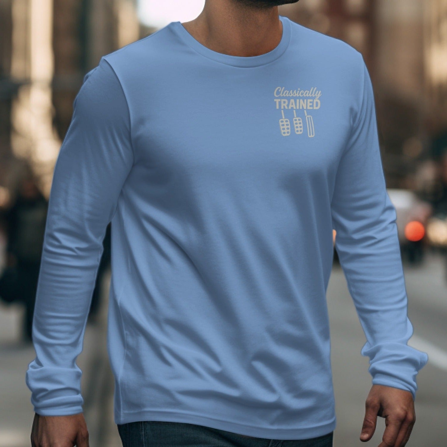 Light blue long sleeve shirt with "Classically TRAINED" and three pedals graphic.