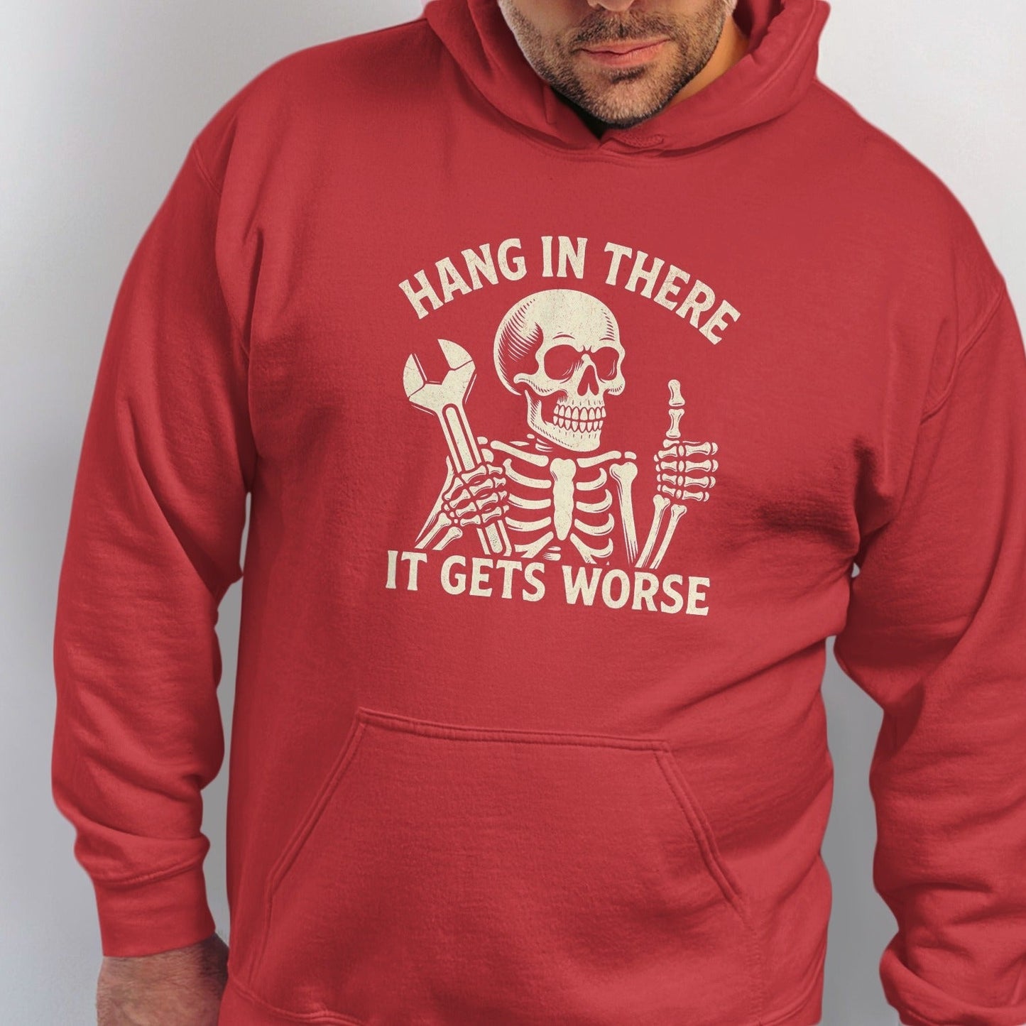 Red hoodie with skeleton graphic and text "Hang in there. It gets worse."