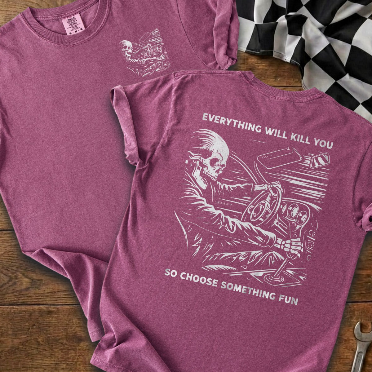 T-shirt with skeleton driving and text: Everything will kill you, so choose something fun.