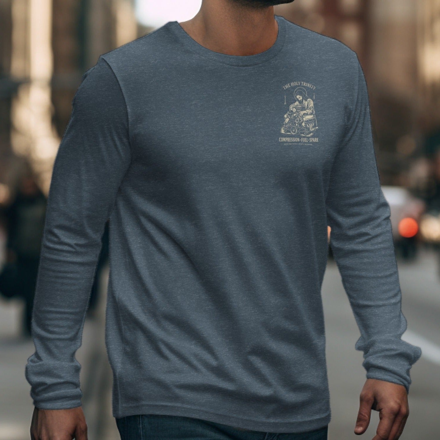 Dark grey long sleeve shirt with a faded graphic of Jesus and an engine on the chest.