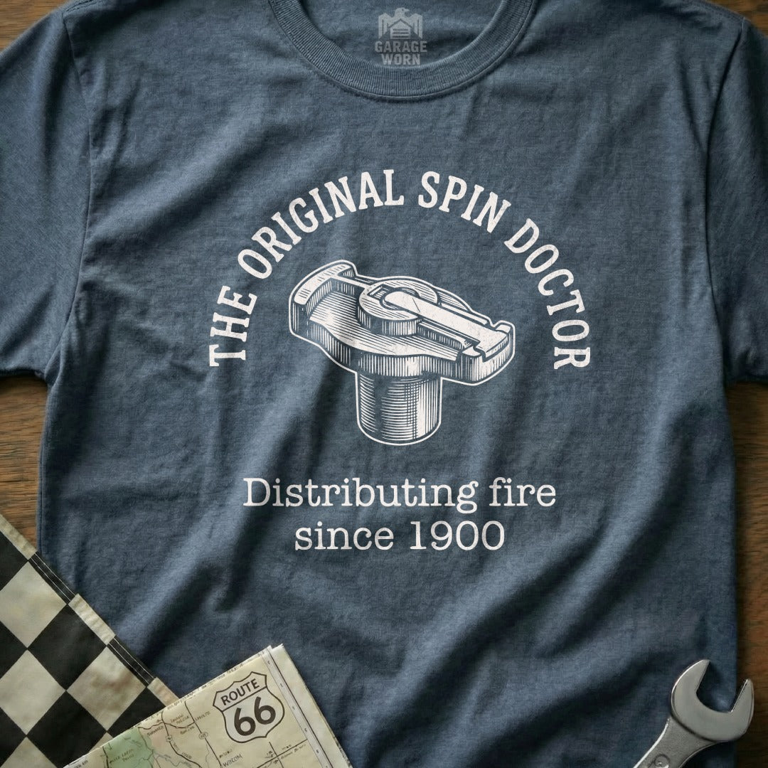 T-shirt with "The Original Spin Doctor" and a distributing cap graphic.