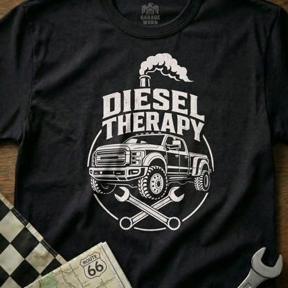 Black t-shirt with white graphic of a diesel truck, smoke, wrenches, and text.