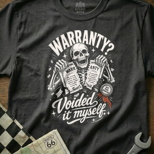 Skeleton holding warranty papers, "Voided it myself" graphic on t-shirt.