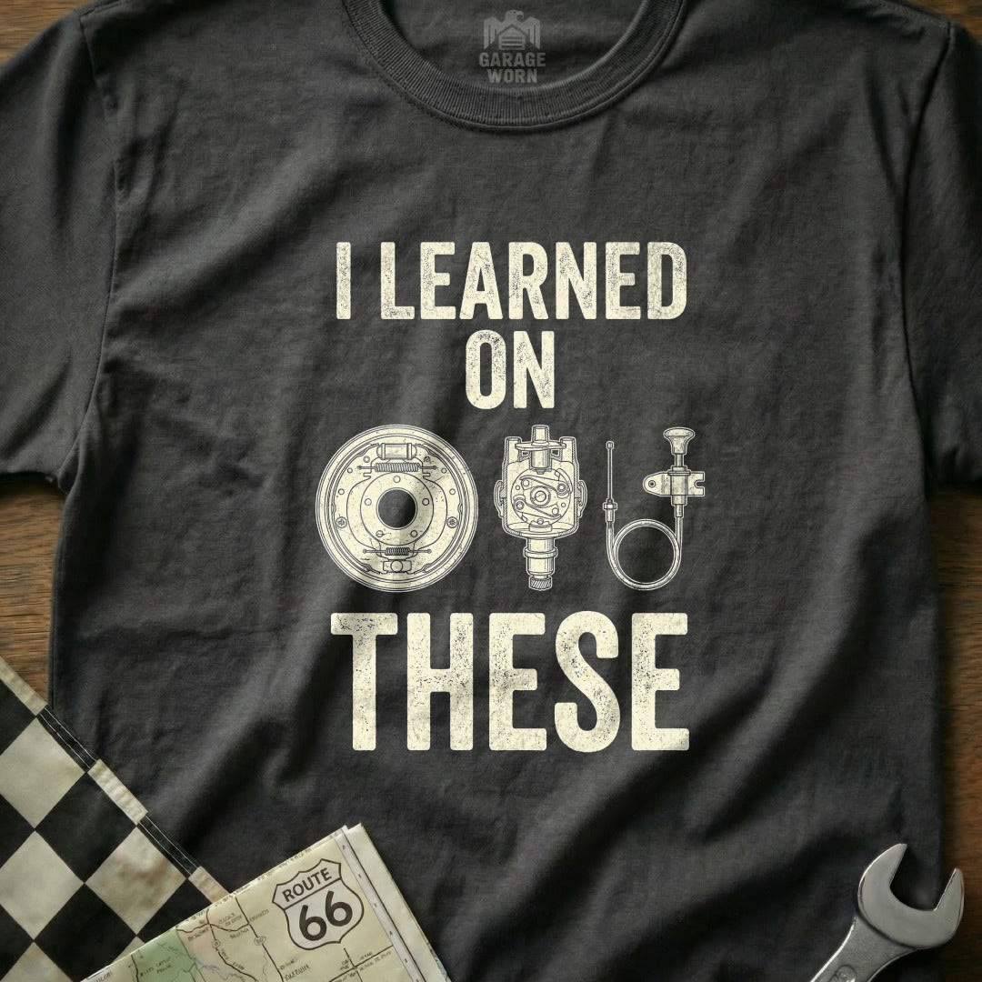 T-shirt with "I LEARNED ON THESE" and vintage car parts.