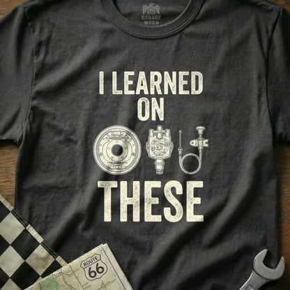 T-shirt with "I LEARNED ON THESE" and vintage car parts.