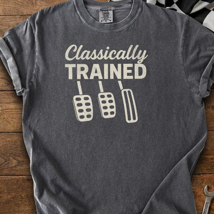 Dark gray t-shirt with "Classically TRAINED" and three car pedals.