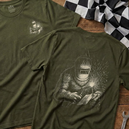 Green t-shirt with Bigfoot welding design on the back.