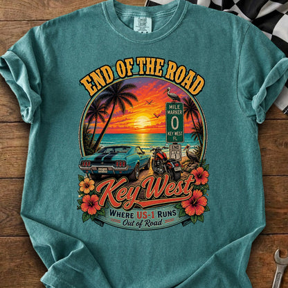 "End of the Road" Key West graphic with car, motorcycle, sunset, and mile marker sign.