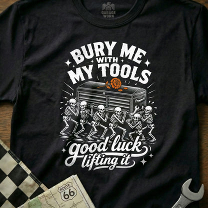 Black t-shirt with skeletons carrying a toolbox, text reads "Bury Me With My Tools Good Luck Lifting It".