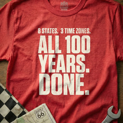Red t-shirt with "8 STATES. 3 TIME ZONES. ALL 100 YEARS. DONE." text.
