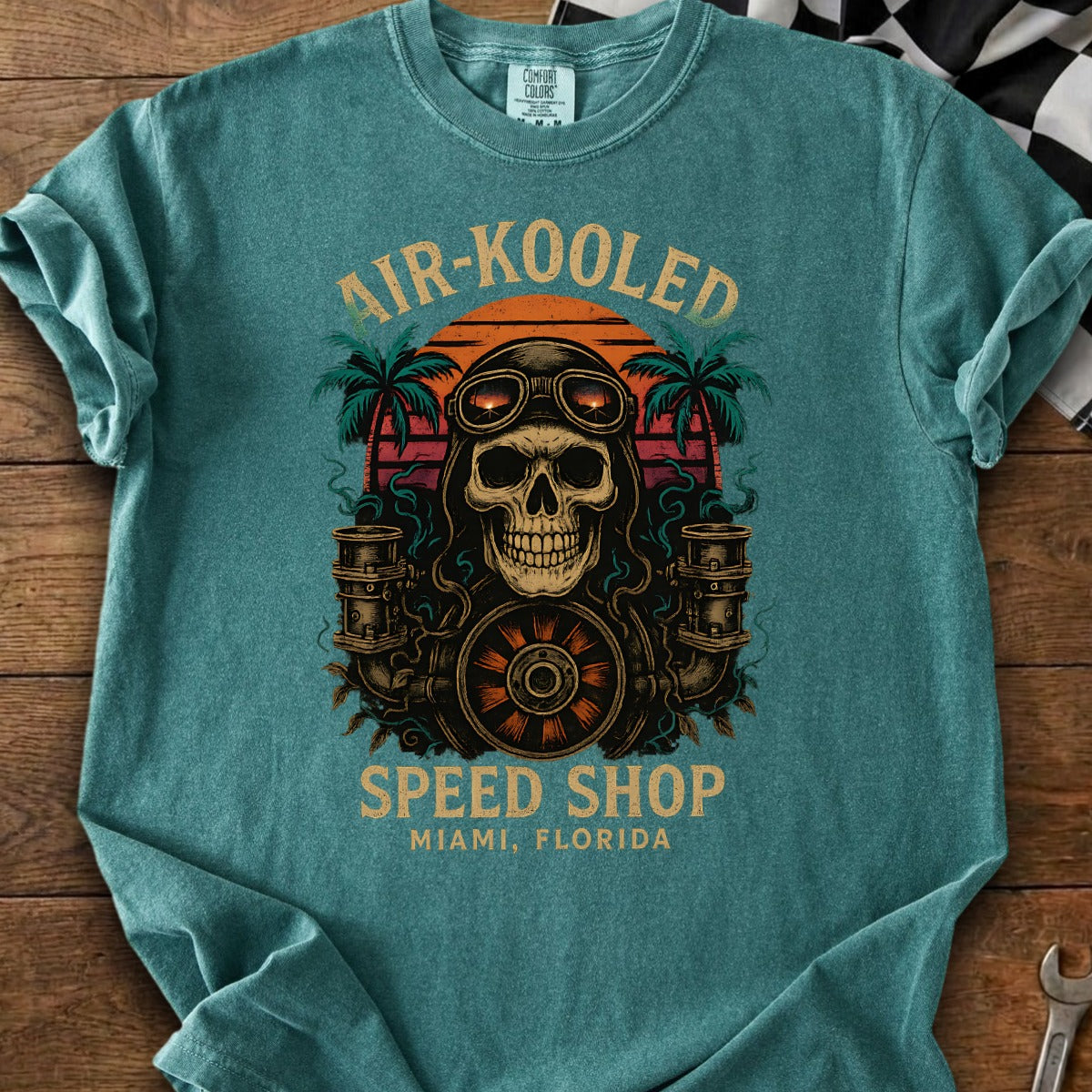 T-shirt with skull, goggles, palm trees, sunset, and text AIR-KOOLD SPEED SHOP MIAMI, FLORIDA.