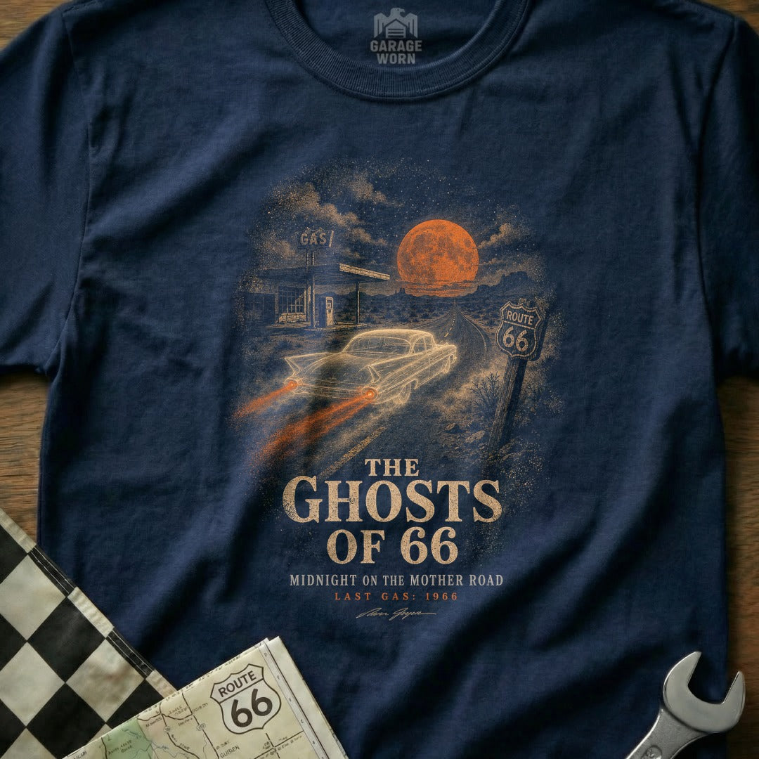 T-shirt graphic: glowing car on Route 66 with gas station and full moon.