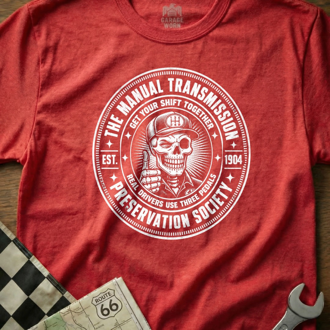 Red t-shirt with manual transmission preservation society and skull graphic.