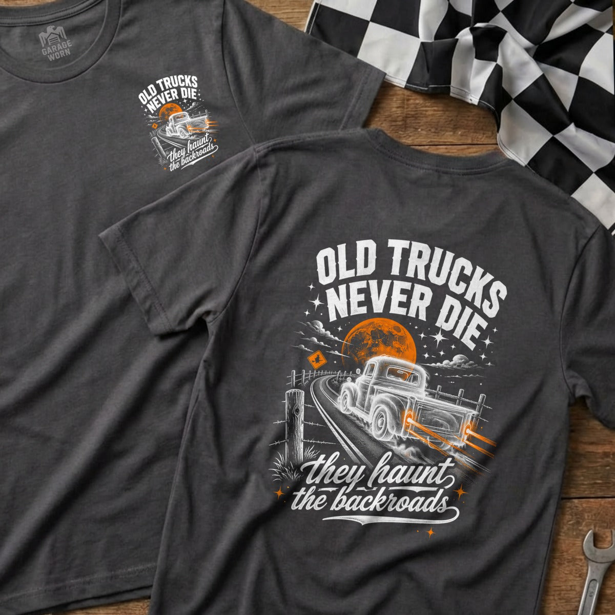 Dark grey t-shirt graphic with "Old Trucks Never Die" and a vintage truck on a backroad.