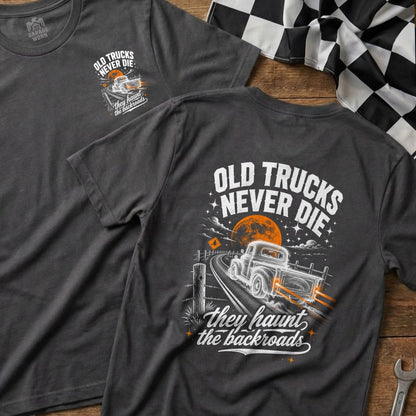 Dark grey t-shirt graphic with "Old Trucks Never Die" and a vintage truck on a backroad.