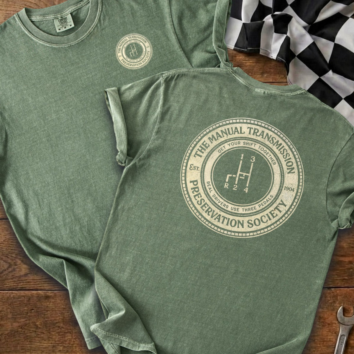 Green t-shirt with "The Manual Transmission Preservation Society" circle graphic.