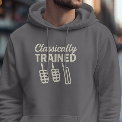 Gray hoodie with "Classically TRAINED" text and three manual car pedals graphic.