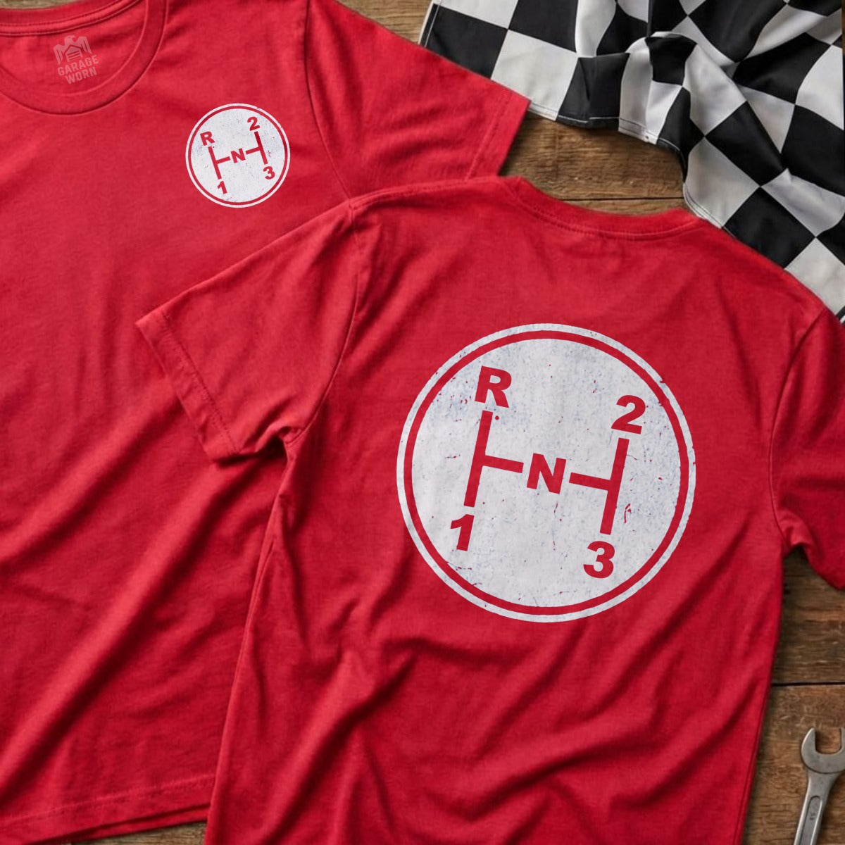 Red t-shirts with a circular manual gear shift pattern graphic.