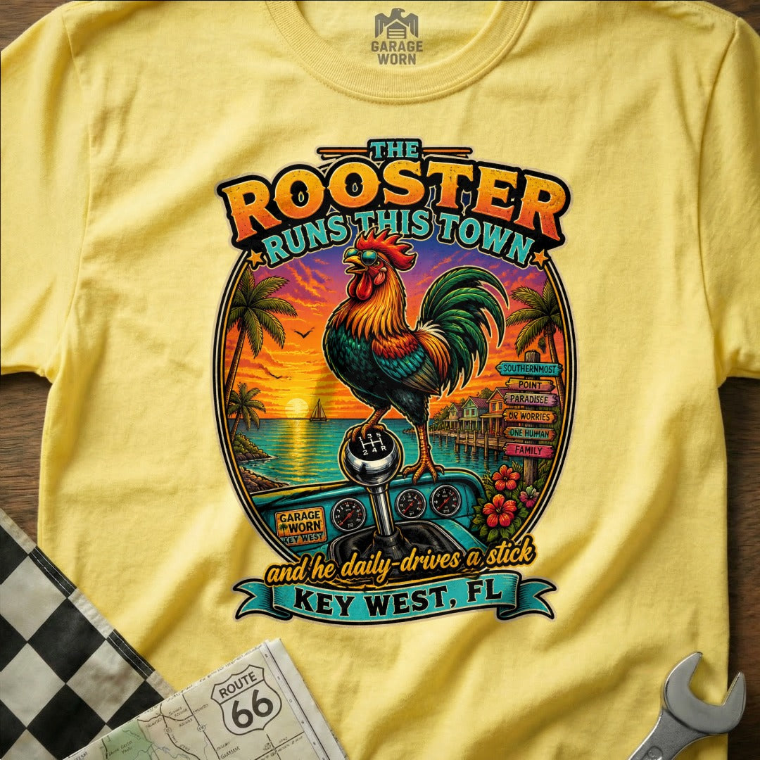 Rooster on a stick shift with "The Rooster Runs This Town" and "Key West, FL".