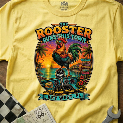 Rooster on a stick shift with "The Rooster Runs This Town" and "Key West, FL".