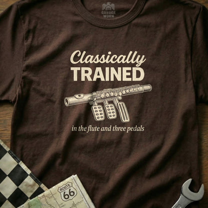Brown t-shirt with "Classically Trained in the flute and three pedals" text and flute design.
