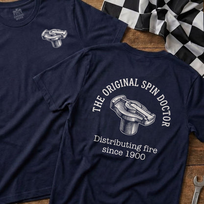 Dark blue t-shirt with "The Original Spin Doctor" and "Distributing fire since 1900" text.