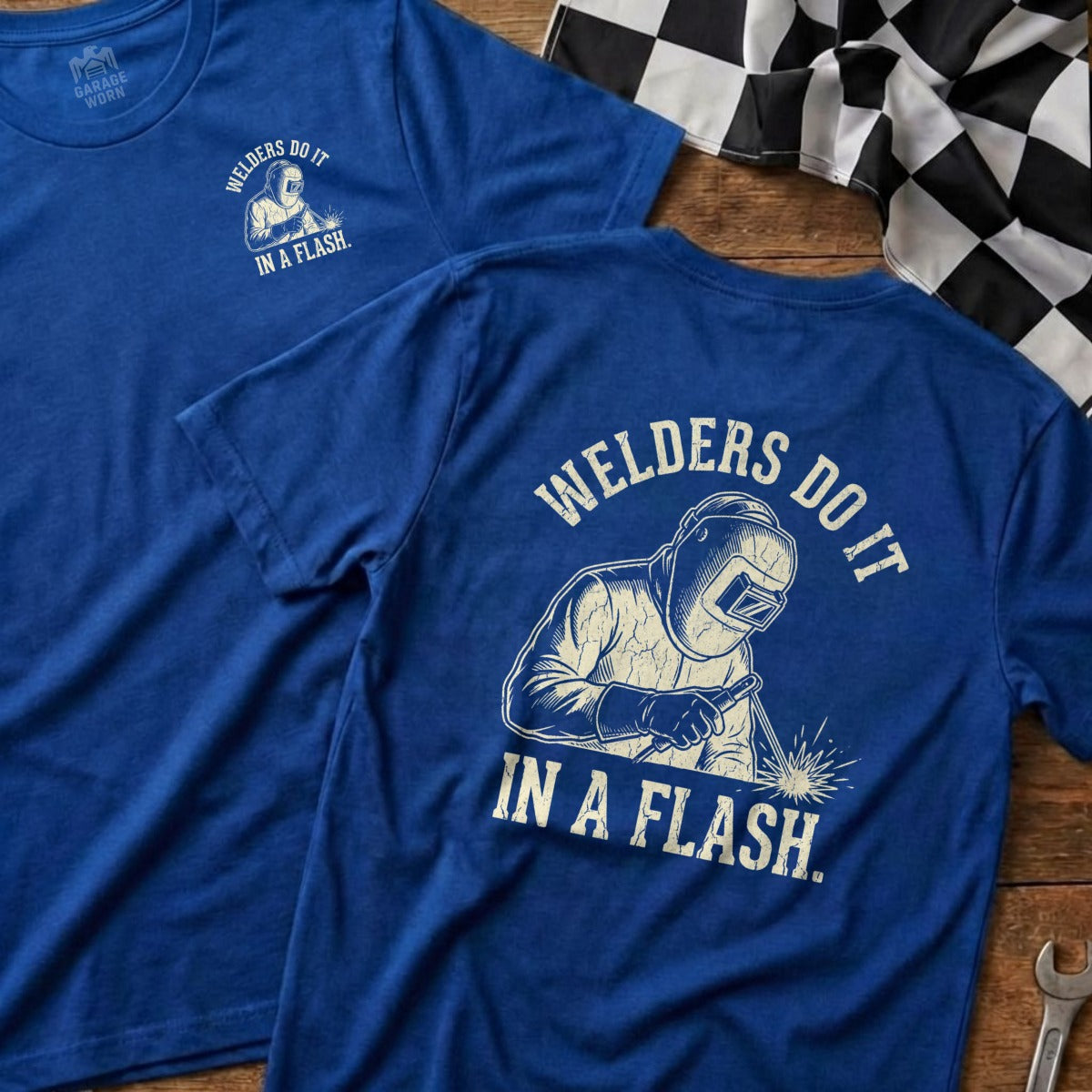 Blue t-shirt with "Welders Do It In A Flash" and welding graphic.