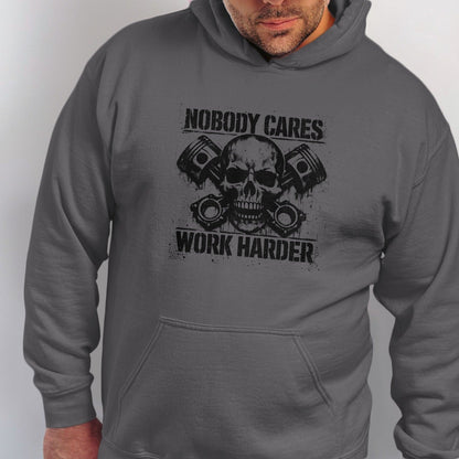 Grey hoodie with black graphic of skull, pistons, and text "NOBODY CARES WORK HARDER".