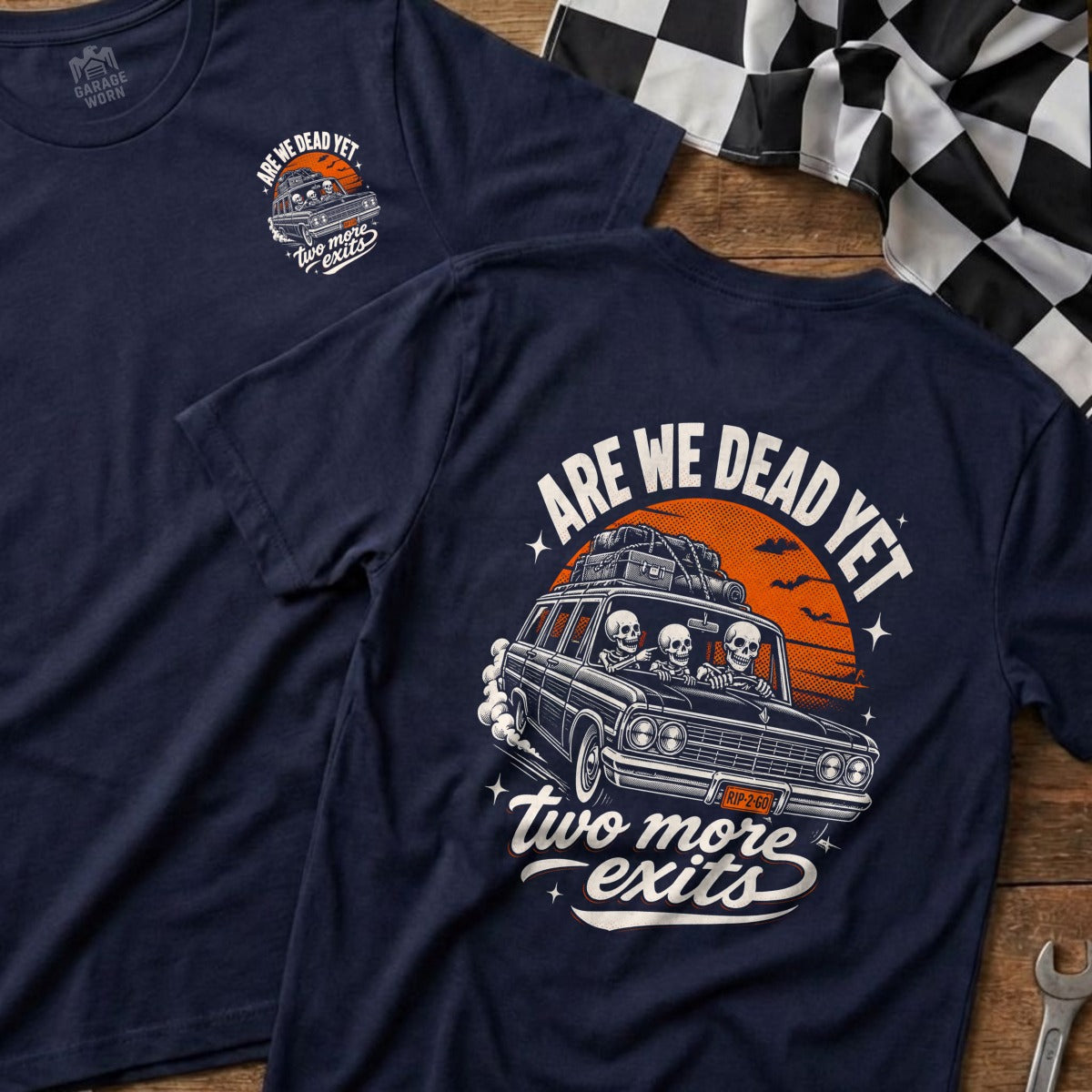 Dark navy t-shirt with "Are We Dead Yet" and skeletons in a car graphic.