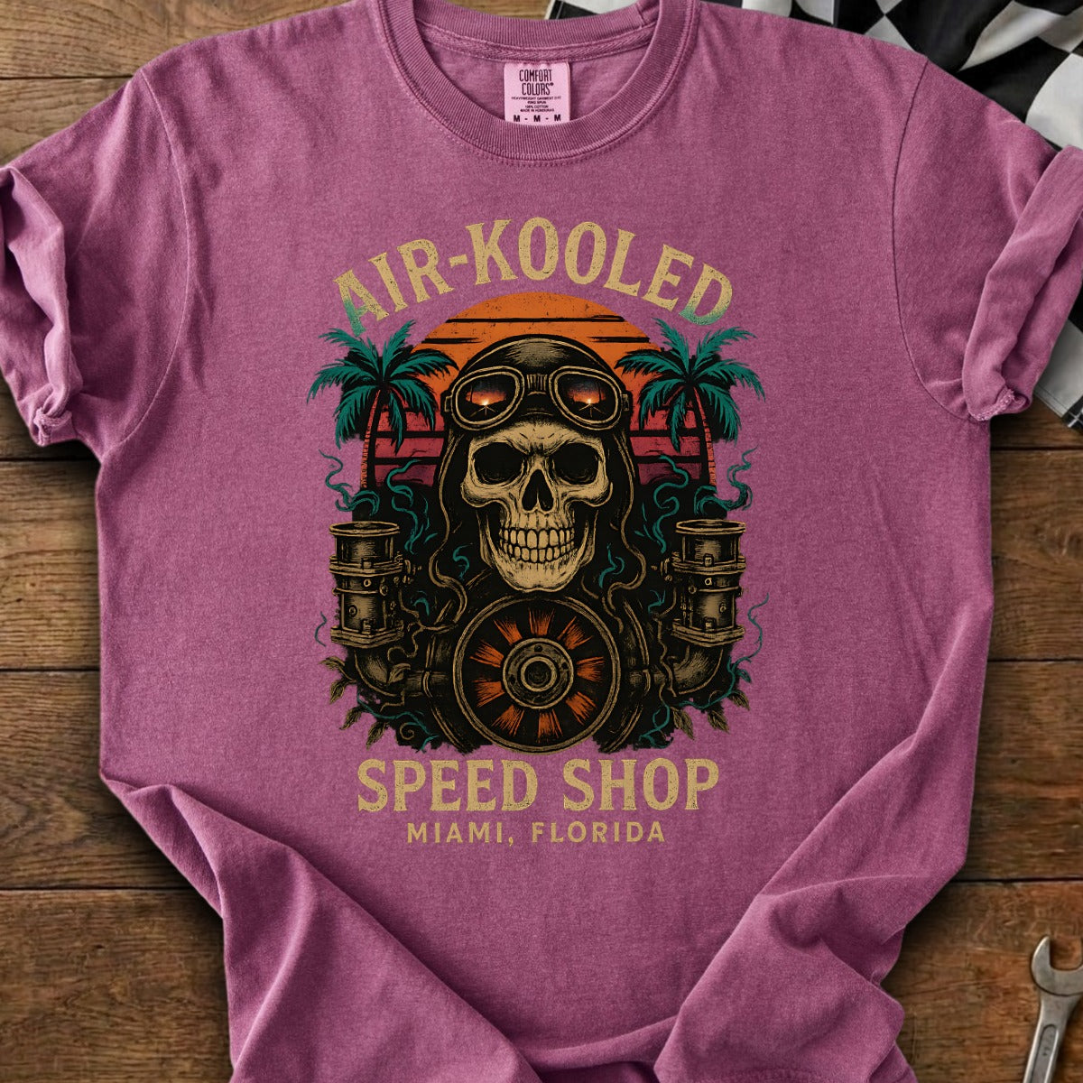 T-shirt with skull wearing goggles, palms, and text "AIR-KOOLEDSPEED SHOP MIAMI, FLORIDA".