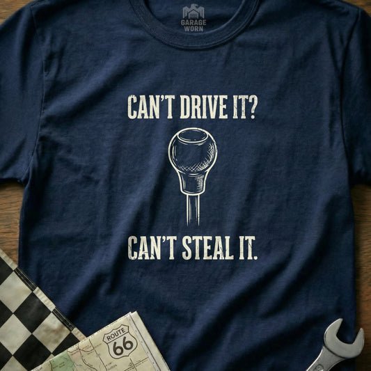 Navy t-shirt with "Can't Drive It? Can't Steal It." and a gear shift graphic.