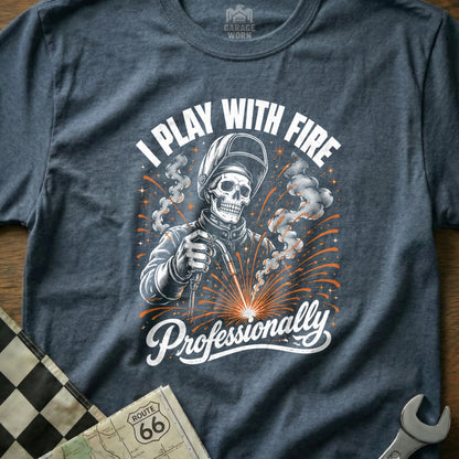 T-shirt graphic of a skeleton welder saying "I PLAY WITH FIRE Professionally".