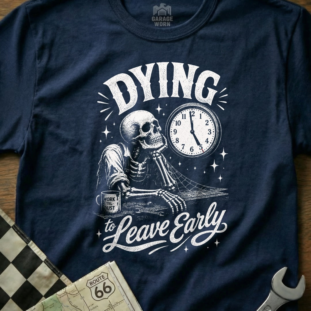 T-shirt with a skeleton at a desk, clock, and "Dying to Leave Early" text.